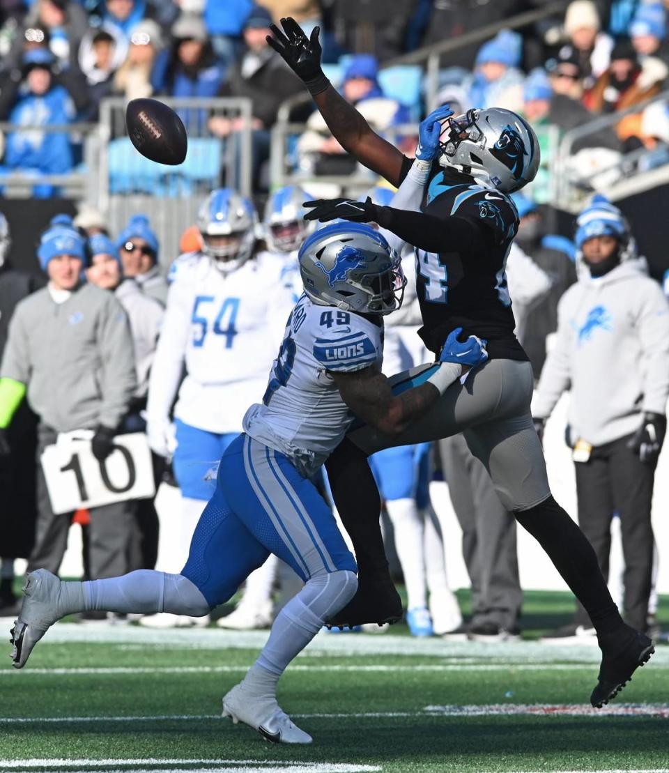 Carolina Panthers tight end Stephen Sullivan, right, battles in an attempt to make a pass reception against Detroit Lions linebacker Chris Board, left, during second quarter action at Bank of America Stadium on Saturday, December 24, 2022 in Charlotte, NC.