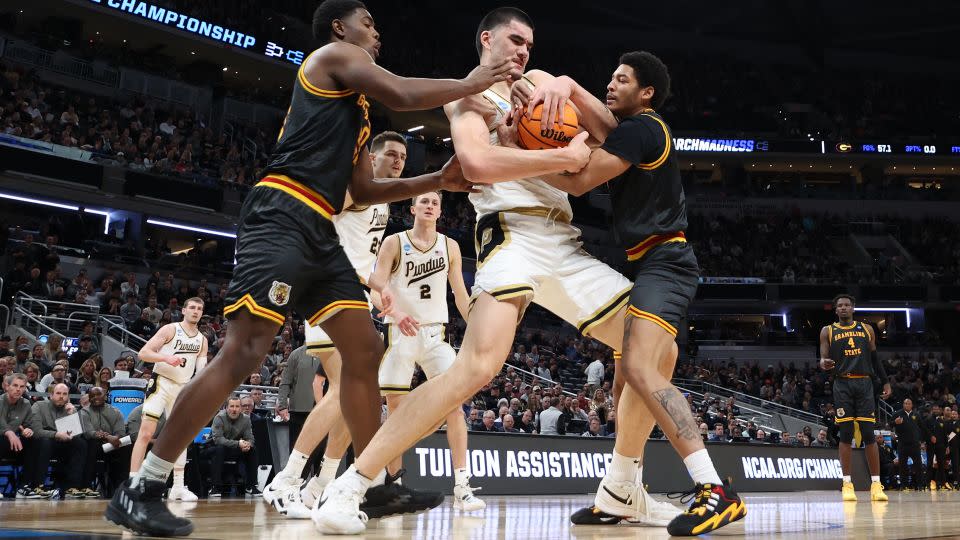 Edey fights for a rebound with Jimel Cofer of the Grambling State Tigers during the first half. - Andy Lyons/Getty Images