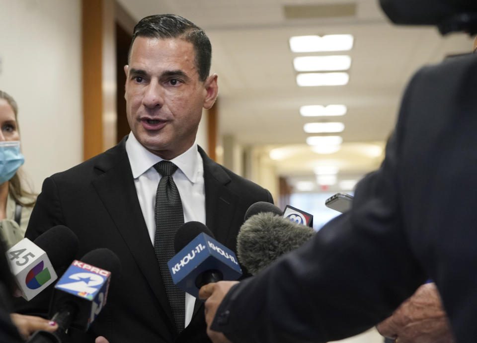 Rick Ramos, an attorney representing the family of victim Arlene Alvarez, speaks after defendant Tony D. Earls appeared in the Harris County 263rd District Criminal Court Thursday, Feb. 17, 2022, in Houston. Tony D. Earls is accused of shooting and killing 9-year-old, Arlene Alvarez, while firing at what he thought was a robbery suspect's vehicle as her father drove her and her siblings by a Chase bank. (Melissa Phillip/Houston Chronicle via AP)