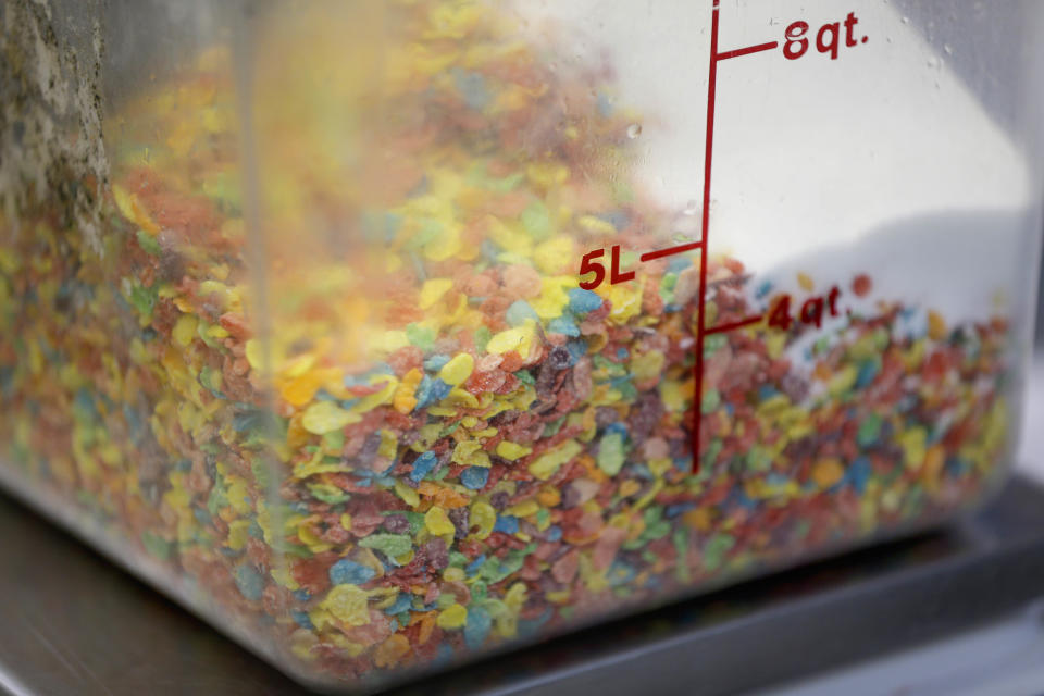 In this Thursday, Feb. 21, 2013 photo, Fruity cereal milk is made using Fruity Pebbles cereal and other ingredients at the Milk Bar kitchen in New York. Cereal is going out of the box. Milk, ice cream, muffin mix and more are being infused with the flavor of the classic childhood treat. (AP Photo/Seth Wenig)