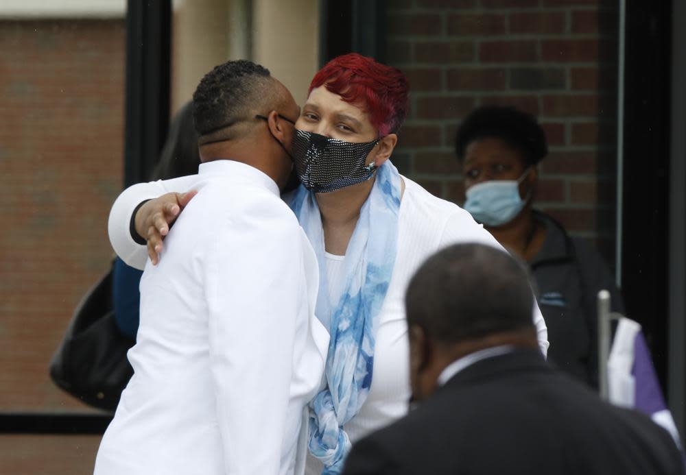 Mourners embrace outside of the First Church of God as they arrive for the funeral for 16-year-old Ma’Khia Bryant in Columbus, Ohio. Friday, April 30, 2021. (AP Photo/Paul Vernon)