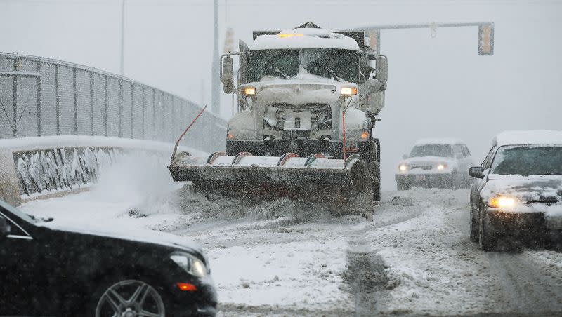 A snowplow clears the freshly fallen snow on 3300 South in Salt Lake County April 15, 2015. Salt Lake County has approved pay raises of its county employees.