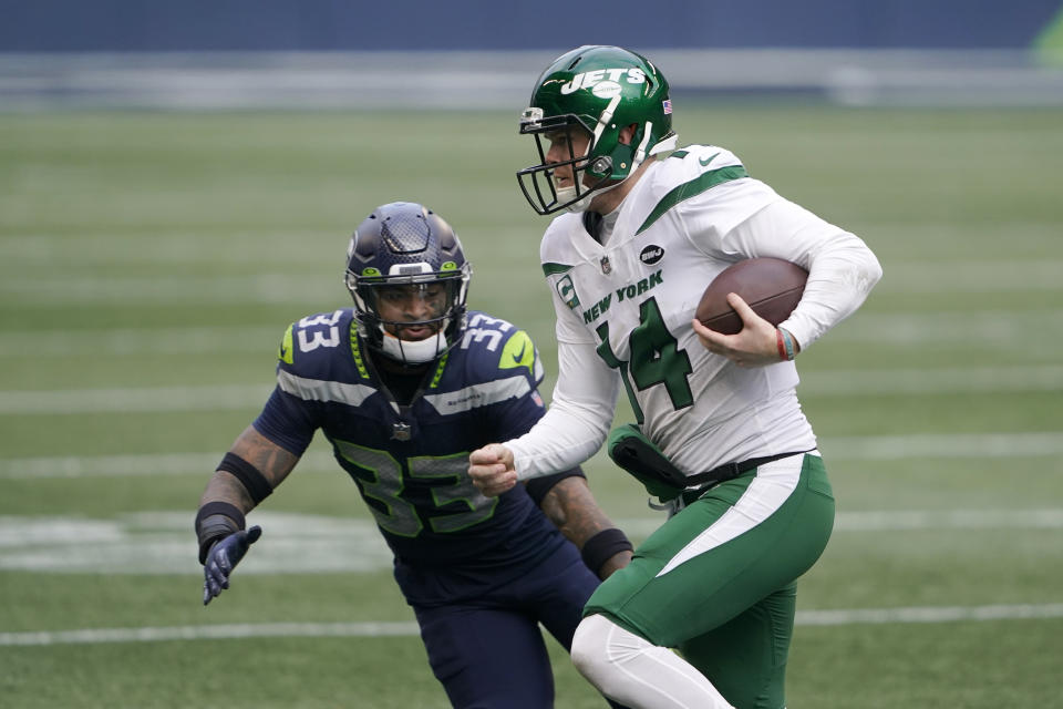 Seattle Seahawks strong safety Jamal Adams (33) pressures New York Jets quarterback Sam Darnold during the first half of an NFL football game, Sunday, Dec. 13, 2020, in Seattle. (AP Photo/Ted S. Warren)