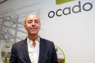 Ocado robots are seen inside a warehouse in Erith