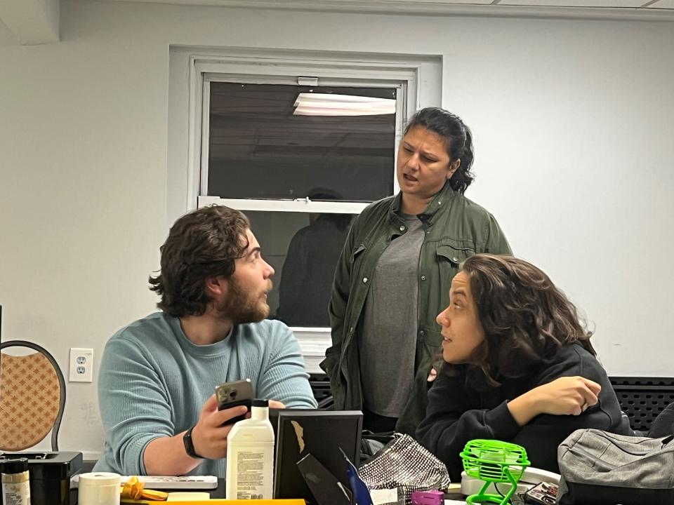 From left to right, Giancarlo Herrera, Bilgin Turker and Isabelle Deveaux rehearse for "The Box Office," a play by University of Vermont graduate Claire Crowley