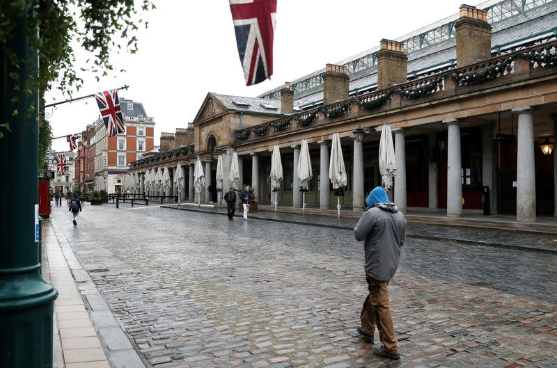 A man walks through Covent Garden amid the coronavirus disease (COVID-19) outbreak in London