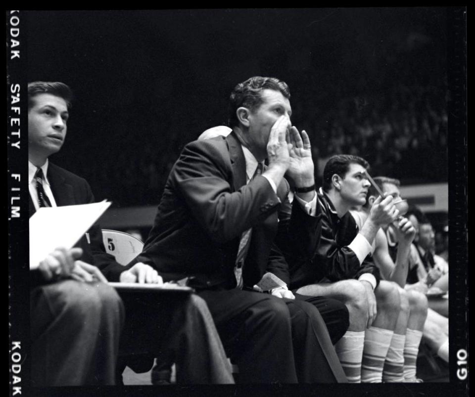 Frank McGuire on the UNC bench during 1957 ACC Tournament.