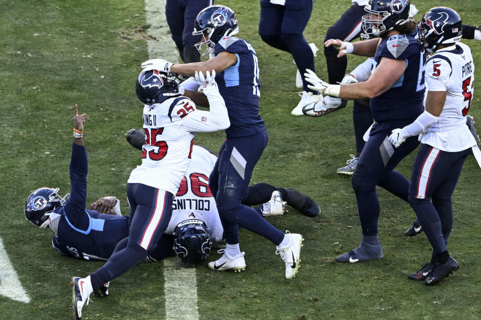 Tennessee Titans quarterback Malik Willis (7) celebrates his touchdown against the Houston Texans during the second half of an NFL football game, Saturday, Dec. 24, 2022, in Nashville, Tenn. (AP Photo/John Amis)