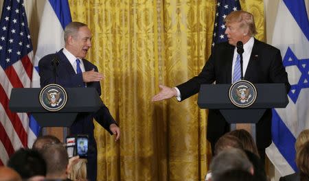 U.S. President Donald Trump (R) greets Israeli Prime Minister Benjamin Netanyahu after a joint news conference at the White House in Washington, U.S., February 15, 2017. REUTERS/Kevin Lamarque