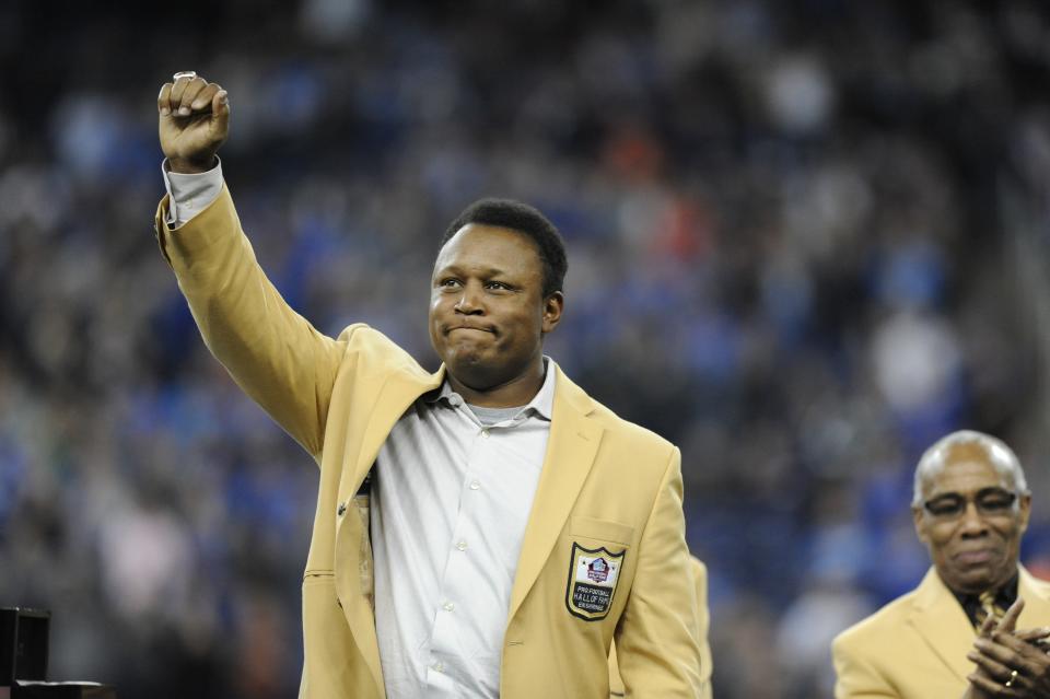 FILE - Detroit Lions running back Barry Sanders acknowledges the crowd after receiving a Pro Football Hall of Fame ring during a ceremony at halftime of an NFL football game between the Lions and the Chicago Bears, Oct. 18, 2015, in Detroit. A movie about the franchise’s greatest running back and his sudden retirement has become Amazon Prime Video’s most-viewed documentary. “Bye Bye Barry” looks back at Sanders' 10-year career with the Lions and his decision to retire in 1999 despite being on the cusp of becoming the NFL’s all-time leading rusher. (AP Photo/Jose Juarez, File)