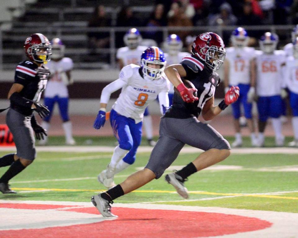 Patterson receiver Jace Johnson (12) sprints downfield after catching a pass During a Division IV Sac Joaquin Section Football Playoff game between Patterson and Kimball at Patterson High School in Patterson CA on November 10, 2023.