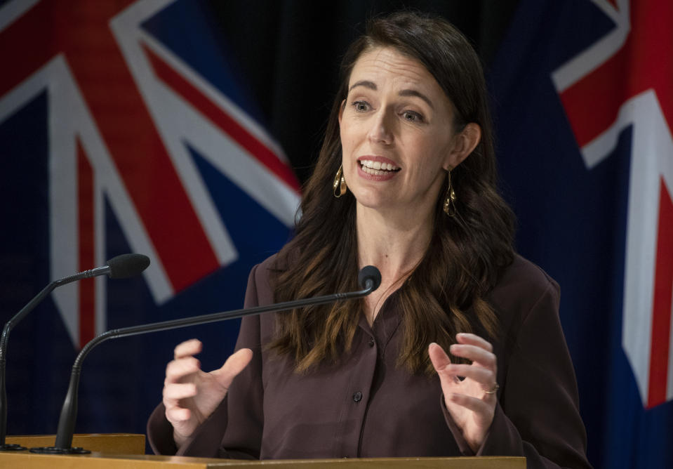 New Zealand Prime Minister Jacinda Ardern gestures during a post-Cabinet press conference at Parliament in Wellington, New Zealand, Monday, Nov. 8, 2021. The lockdown of New Zealand's largest city, Auckland, for almost three months after an outbreak of the delta variant, is likely to end later this month, with some coronavirus restrictions being eased Tuesday, Nov. 9. (Mark Mitchell/Pool Photo via AP)