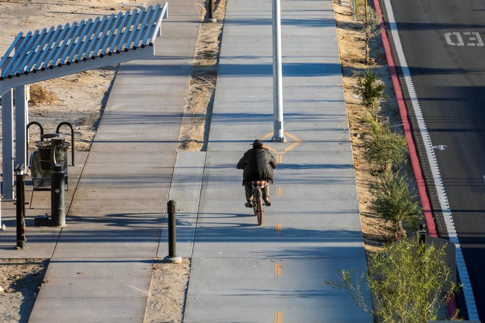 A cyclist rides along Grapefruit Boulevard in Coachella on Dec. 8.