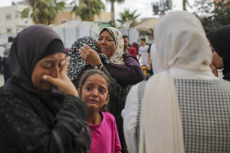 Palestinian women mourn near the bodies of relatives killed in an Israeli airstrike, outside the morgue in Al-Aqsa Martyrs Hospital in Deir al Balah, the Gaza Strip, Monday, June 10, 2024. (AP Photo/Jehad Alshrafi)