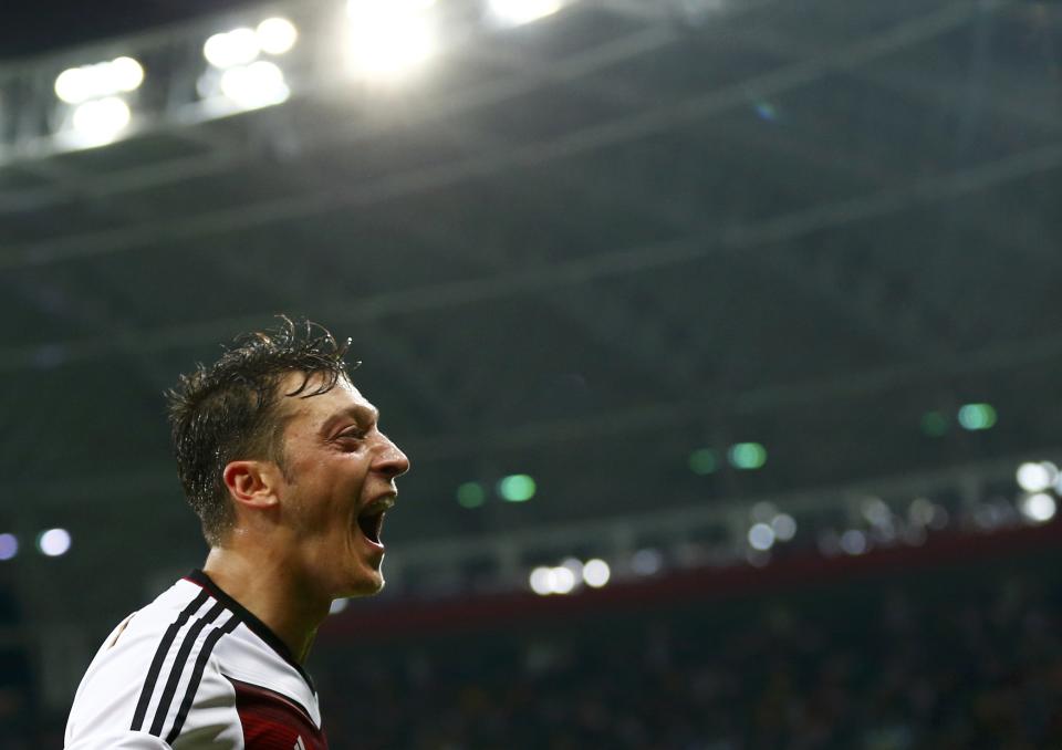 Germany's Mesut Ozil celebrates scoring his team's second goal against Algeria during extra time in their 2014 World Cup round of 16 game at the Beira Rio stadium in Porto Alegre June 30, 2014. REUTERS/Darren Staples