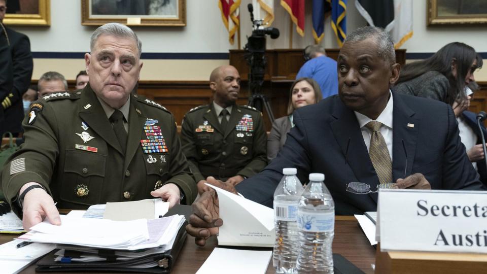 Army Gen. Mark Milley, chairman of the Joint Chiefs of Staff, and Defense Secretary Lloyd Austin testify before the House Armed Services Committee on March 29. (Jose Luis Magana/AP)