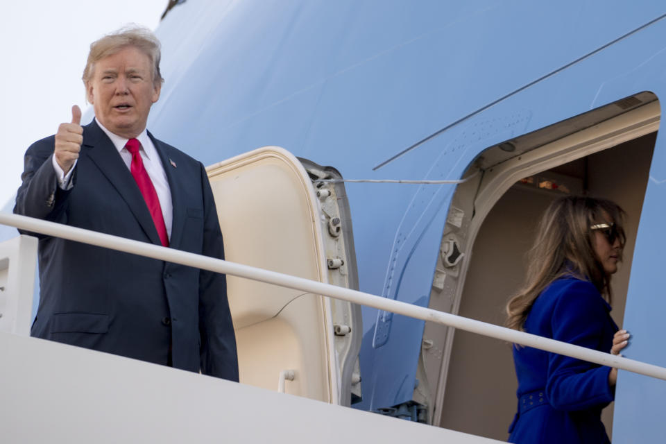 President Trump gives a thumbs-up as he and first lady Melania Trump board Air Force One at Andrews Air Force Base, Md. (Photo: Andrew Harnik/AP)