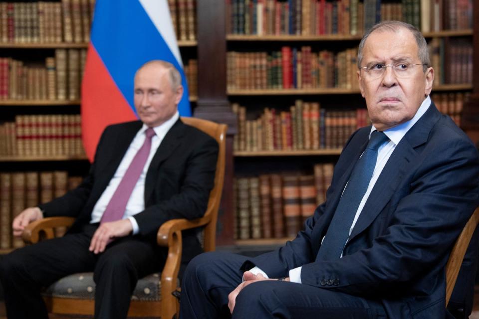 Lavrov, right, with Putin at a summit with the US in Geneva last year (AFP/Getty)
