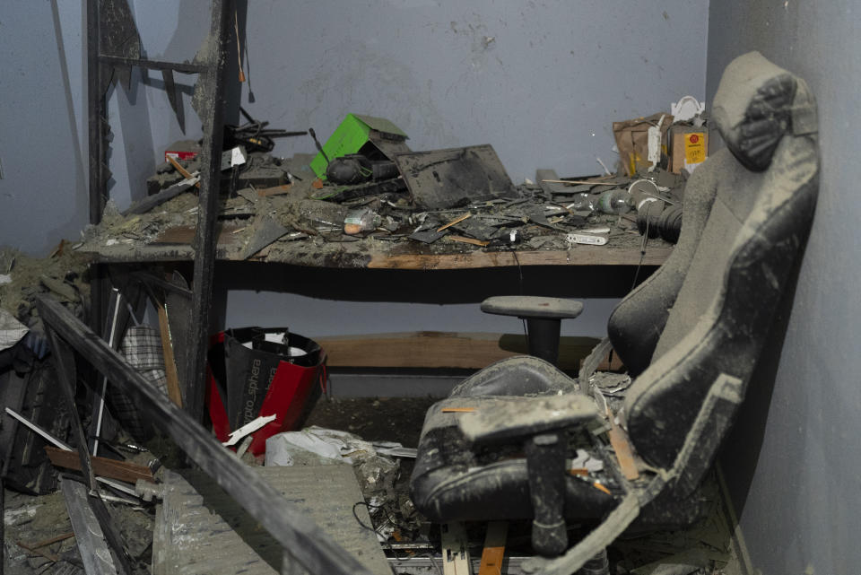 Debris litters a damaged room of an apartment in Kyiv, Ukraine, Thursday, July 13, 2023, following Russia's air attacks targeting the capital city. (AP Photo/Jae C. Hong)