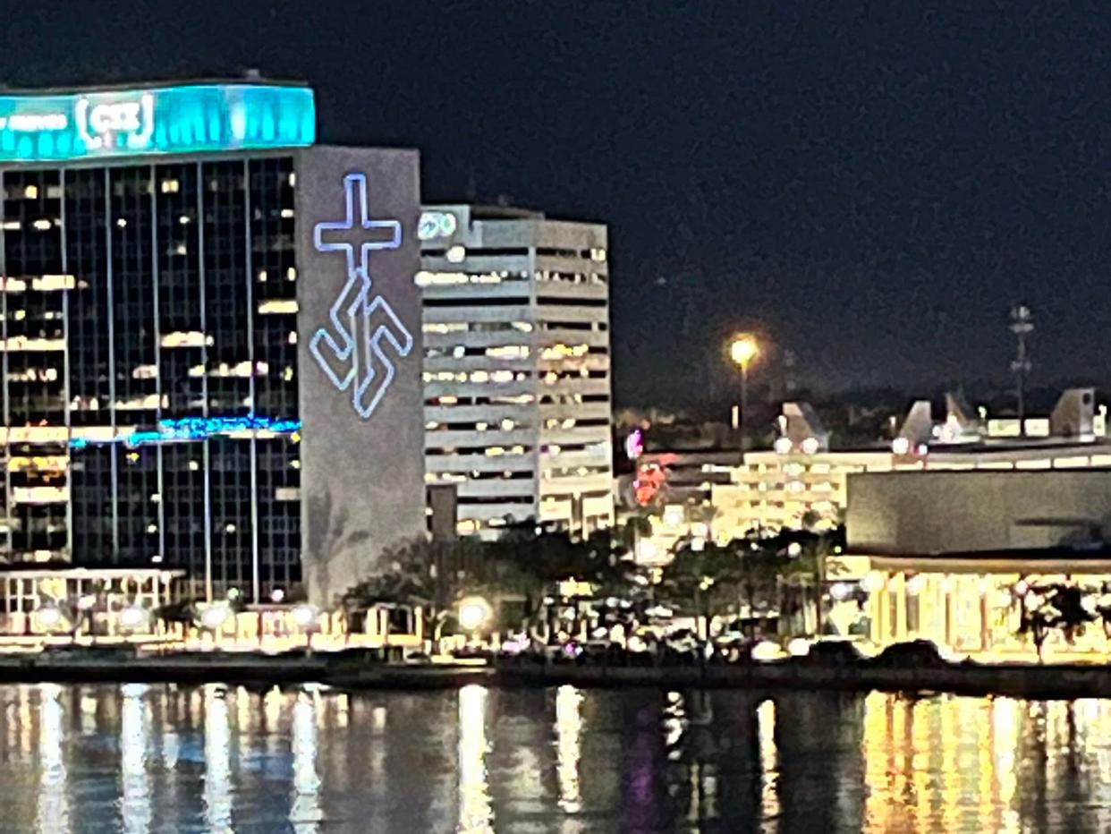 image of swastika and cross projected onto Florida building