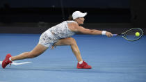 Ash Barty of Australia plays a backhand return to Danielle Collins of the U.S. during the women's singles final at the Australian Open tennis championships in Saturday, Jan. 29, 2022, in Melbourne, Australia. (AP Photo/Andy Brownbill)