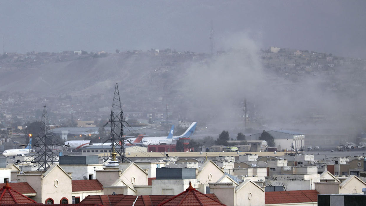 Smoke rises from explosion outside the airport in Kabul, Afghanistan, Thursday, Aug. 26, 2021. (Wali Sabawoon/AP Photo)