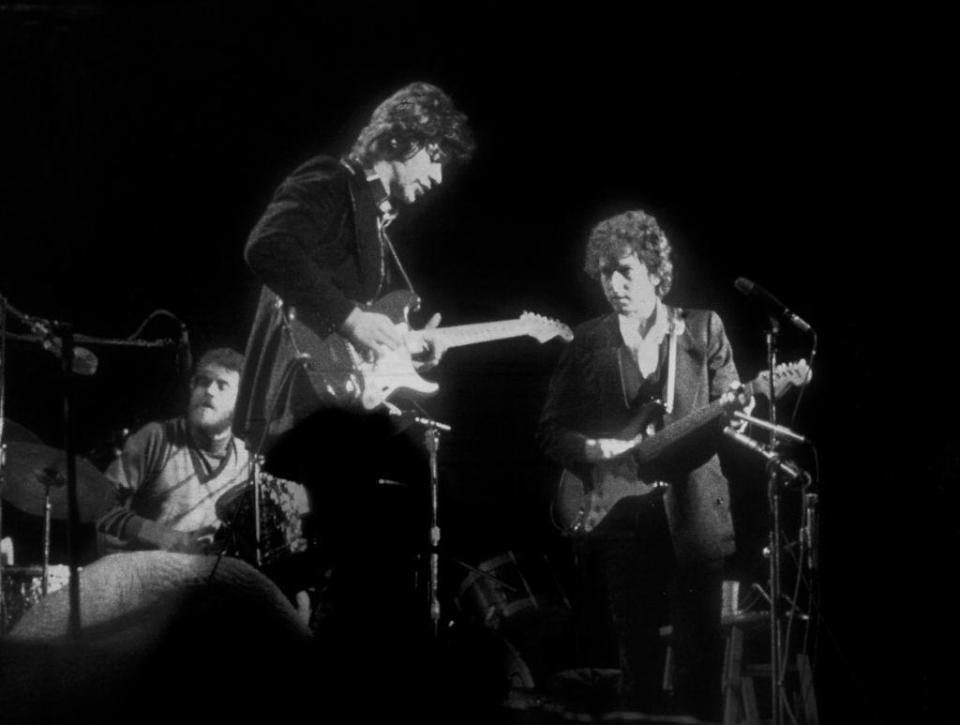 Bob Dylan and the Band perform at Madison Square Gardens, (L-R) Levon Helm, Robbie Robertson and Bob Dylan, in New York on 29th January 1974. / Credit: Gijsbert Hanekroot