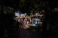 People shop on Olvera Street in Los Angeles, Friday, June 4, 2021. Olvera Street has long been a thriving tourist destination and a symbol of the state's early ties to Mexico. The location of where settlers established a farming community in 1781 as El Pueblo de Los Angeles, its historic buildings were restored and rebuilt as a traditional Mexican marketplace in 1930s. As Latinos in California have experienced disproportionately worse outcomes from COVID-19, so too has Olvera Street. (AP Photo/Jae C. Hong)