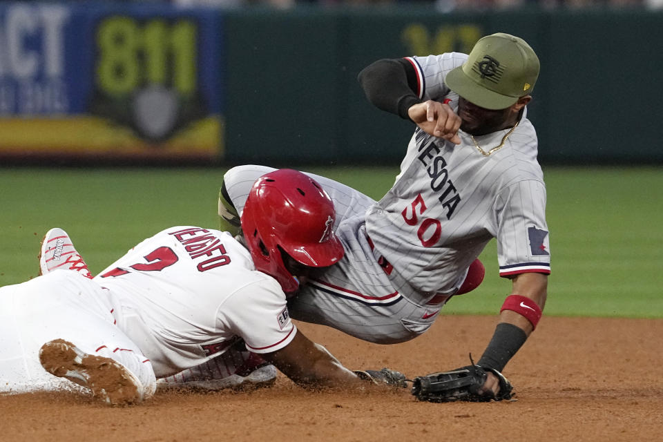 Los Angeles Angels' Luis Rengifo, left, steals second as Minnesota Twins second baseman Willi Castro after missed the throw from home during the fourth inning of a baseball game Friday, May 19, 2023, in Anaheim, Calif. Angels' Brandon Drury scored on the play and Twins catcher Ryan Jeffers was charged with an throwing error on the play. (AP Photo/Mark J. Terrill)