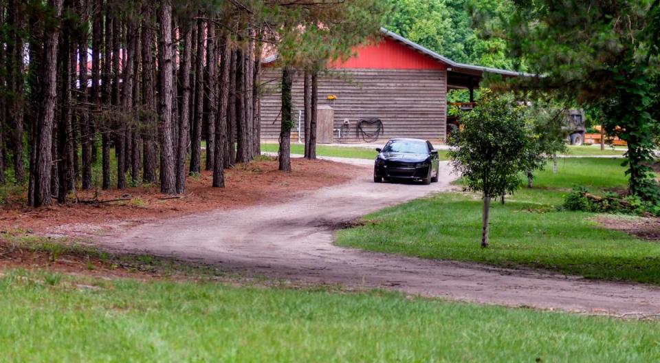 An unidentified car blocks the approach to the Murdaugh family property on Tuesday, June 8, 2021 near the dog kennels where Maggie Murdaugh, 52, and her son Paul Murdaugh, 22, died from gunshot wounds in an apparent homicide in Colleton County.