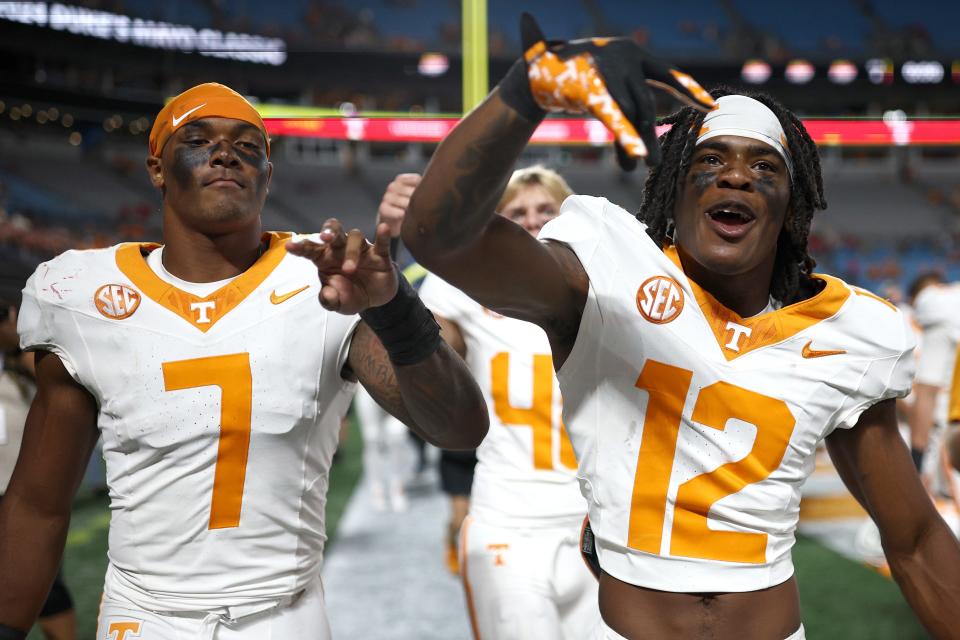 CHARLOTTE, NORTH CAROLINA - SEPTEMBER 07: Arion Carter #7 and John Slaughter #12 of the Tennessee Volunteers react following their 51-10 victory over the NC State Wolfpack in the Duke's Mayo Classic at Bank of America Stadium on September 07, 2024 in Charlotte, North Carolina. (Photo by Jared C. Tilton/Getty Images)