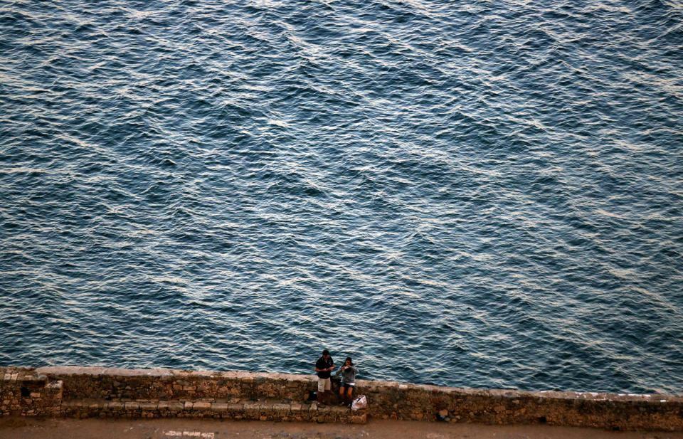 Tourists take photos inside the medieval castle of Monemvasia Yannis Behrakis / Reuters