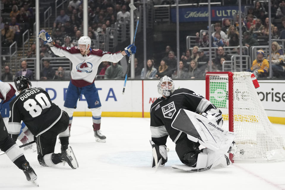 Los Angeles Kings goaltender Cam Talbot, right, reacts after allowing a goal by Colorado Avalanche defenseman Josh Manson during the first period of an NHL hockey game Sunday, Dec. 3, 2023, in Los Angeles. (AP Photo/Ashley Landis)