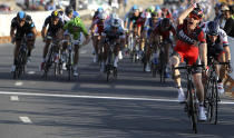 BMC Racing's Brent Bookwalter (R) of the U.S. celebrates winning the first stage of the 2013 Tour of Qatar from Katara Cultural Village to Dukhan Beach in Doha February 3, 2013. REUTERS/Fadi Al-Assaad (QATAR - Tags: SPORT CYCLING) - RTR3DAYL