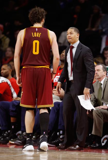 Tyronn Lue takes a moment to offer Kevin Love some motivational swear words. (Gregory Shamus/Getty Images)