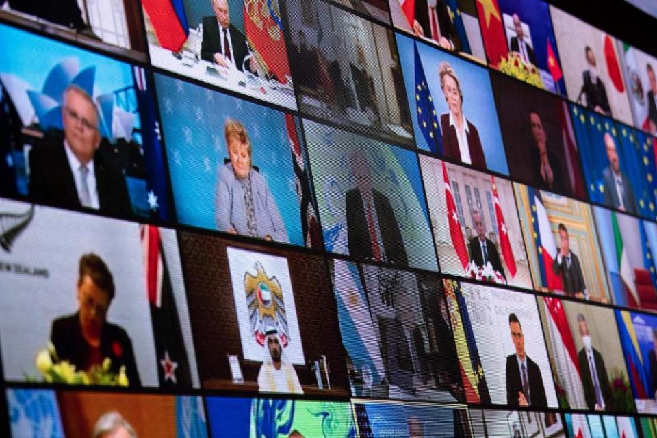 World leaders are seen on a screen during a climate change virtual summit from the East Room of the White House campus April 22, 2021, in Washington, DC.