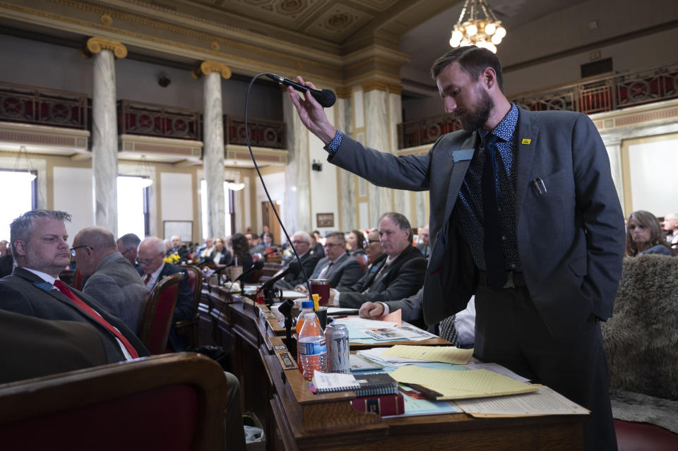 CORRECTS TO DISCIPLINE, NOT CENSURE - Rep. Casey Knudsen puts the microphone down after speaking on the House floor during a motion to discipline Rep. Zooey Zephyr at the Montana State Capitol in Helena, Mont., on Wednesday, April 26, 2023. (AP Photo/Tommy Martino)