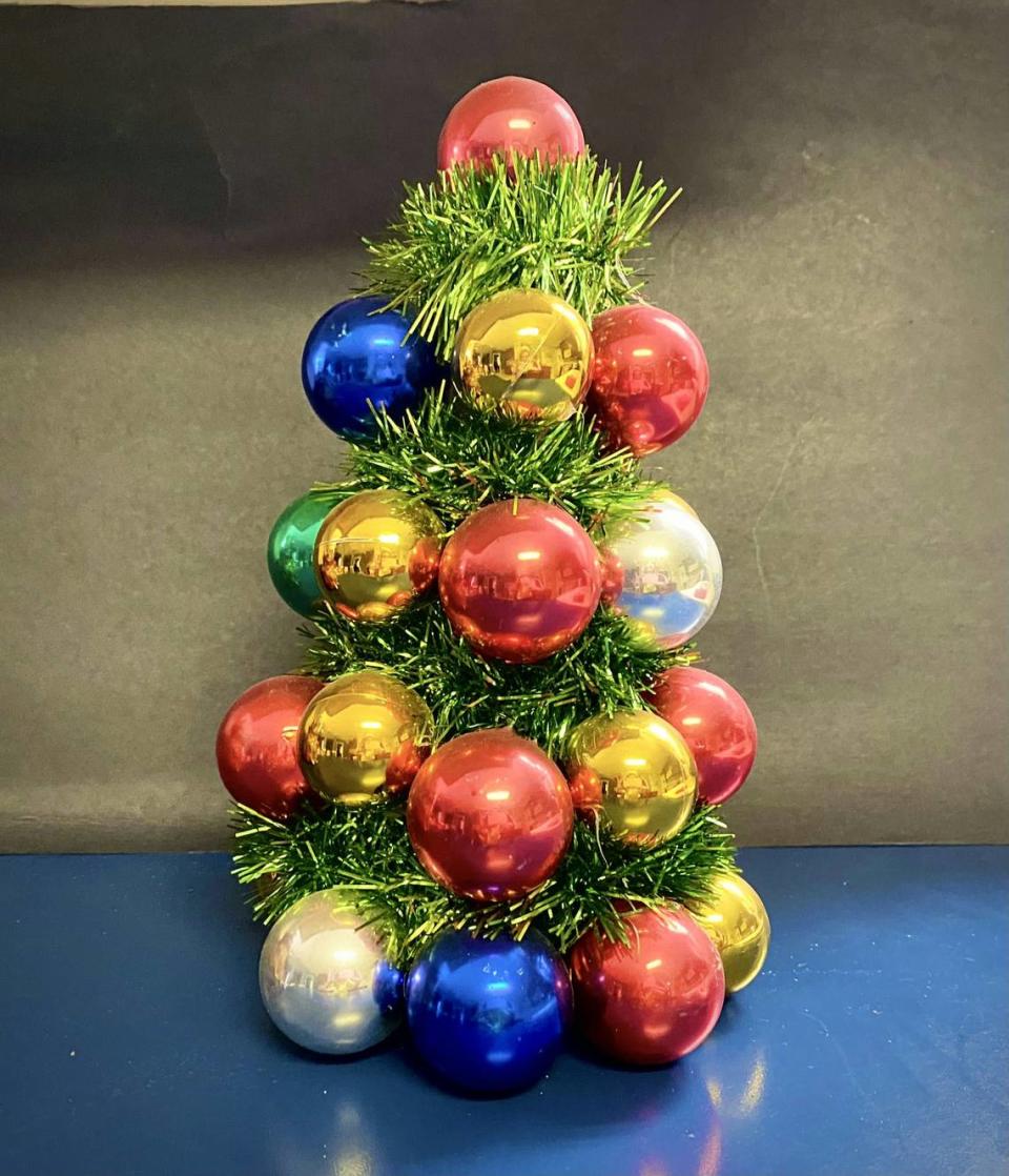 Lee Ann Spahr’s mother sparkled with Christmas joy and it showed in the decorations she made. She built this tree in the 1960s by adhering ornaments to a foam shape. This particular craft has seen a resurgence recently.