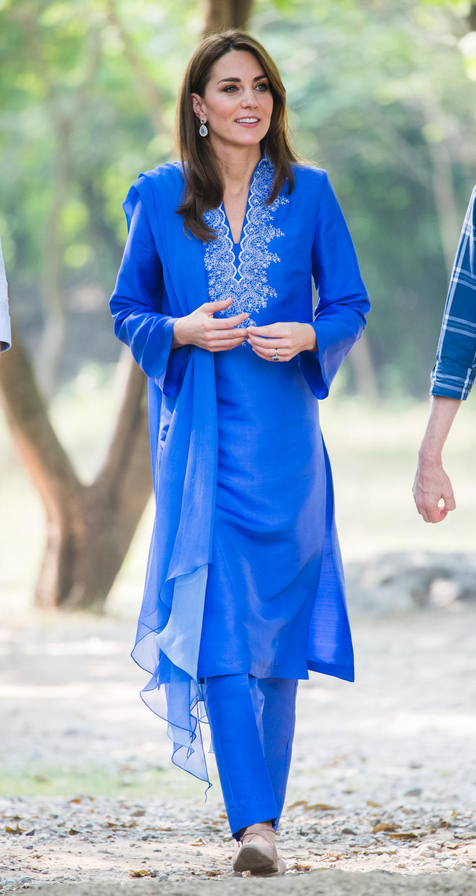 Kate wore a traditional, royal blue shalwar kameez by Pakistani designer Maheen Khan for her first official occasion on the tour. A pair of <a href="https://fave.co/2Mj8bXq" rel="noopener" target="_blank" data-ylk="slk:£24 shoes from New Look;elm:context_link;itc:0;sec:content-canvas" class="link "><strong>£24 shoes from New Look</strong></a> completed the outfit. The Duchess then changed into a pair of <a href="https://fave.co/2MMzGHY" rel="noopener" target="_blank" data-ylk="slk:Russell & Bromley flats, costing £195;elm:context_link;itc:0;sec:content-canvas" class="link "><strong>Russell & Bromley flats, costing £195</strong></a>. <em>[Photo: Samir Hussein/WireImage]</em>