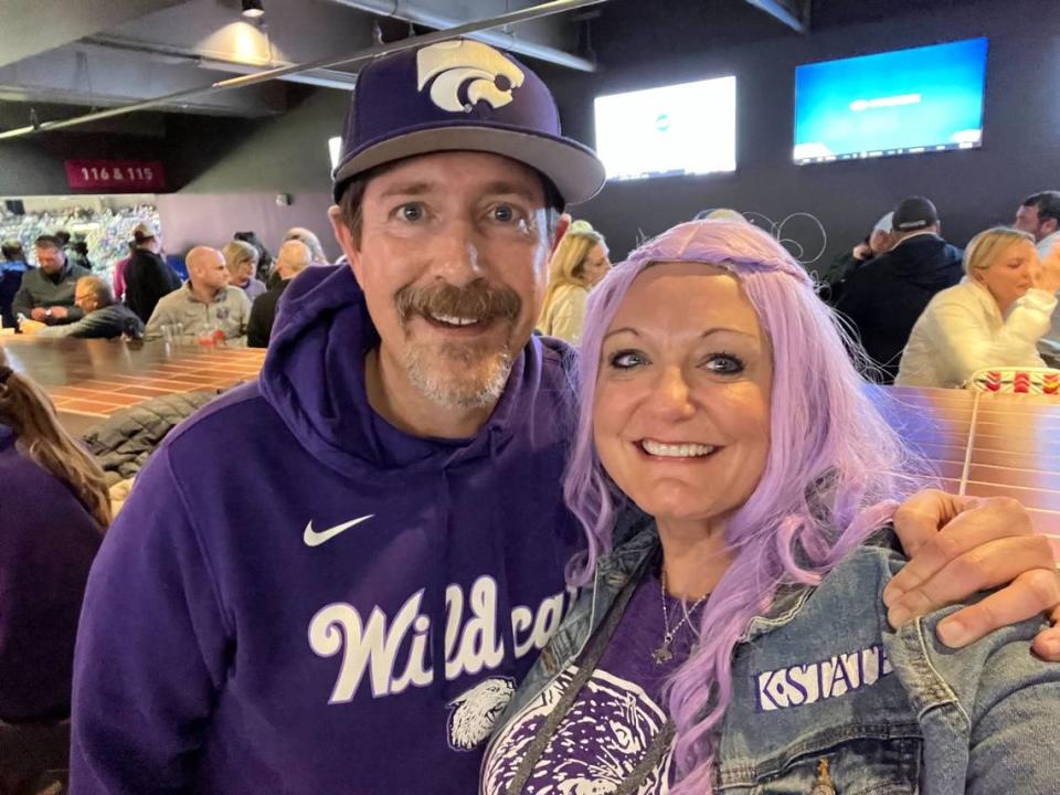 Mitch Moss and Misty Woodward supporting the Wildcats during the Big 12 Tournament. Woodward said one of her superstitions is wearing the purple wig on gamedays