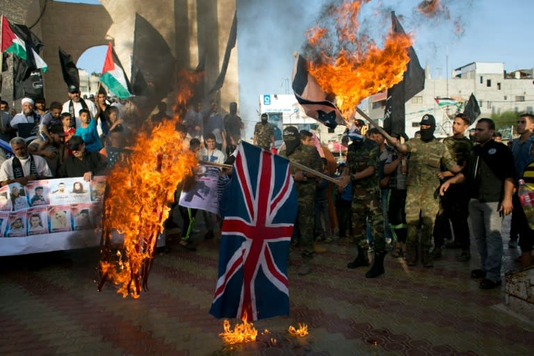 Palestinian extremists burn British, US and Israeli flags during a demonstration to mark the anniversary of the Balfour Declaration in the southern Gaza Strip town of Rafah on November 2, 2015