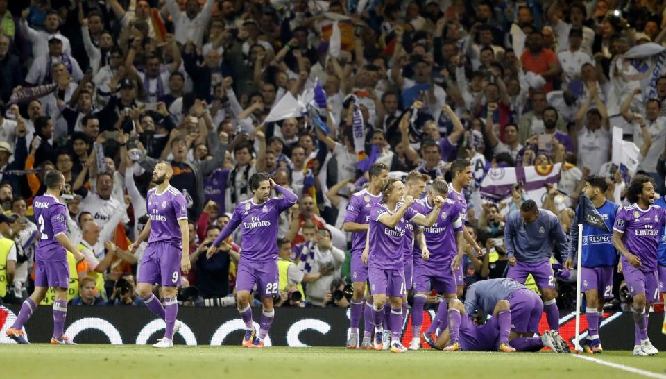 <p>Real Madrid celebrate after Casemiro scored during the Champions League final soccer match between Juventus and Real Madrid at the Millennium stadium in Cardiff, Wales Saturday June 3, 2017. (AP Photo/Frank Augstein) </p>