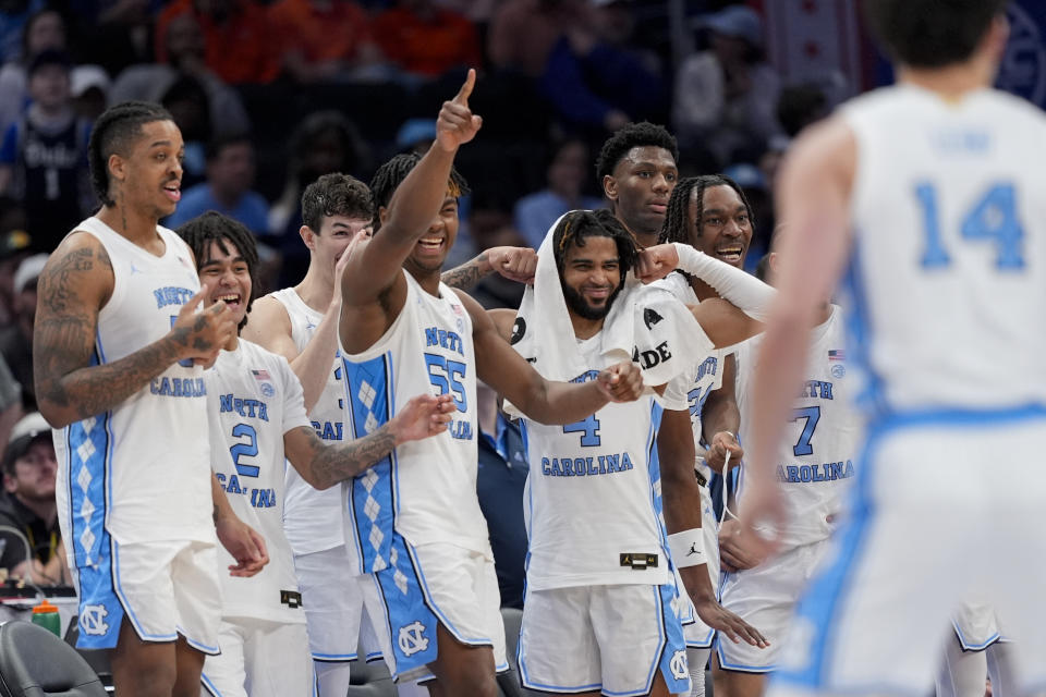 The North Carolina bench celebrates during the second half of an NCAA college basketball game against Florida State in the quarterfinal round of the Atlantic Coast Conference tournament, Thursday, March 14, 2024, in Washington. North Carolina won 92-67. (AP Photo/Susan Walsh)