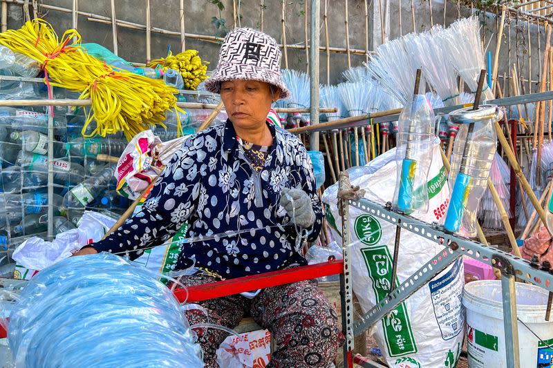 Spinning plastic into broomsticks: Cambodians on mission to reduce waste