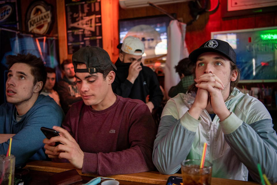 Ohio University fans pack bars to watch their team compete in the 2021 NCAA Tournament as coronavirus disease (COVID-19) restrictions are eased in Athens, Ohio, U.S., March 20, 2021.  REUTERS/Gaelen Morse