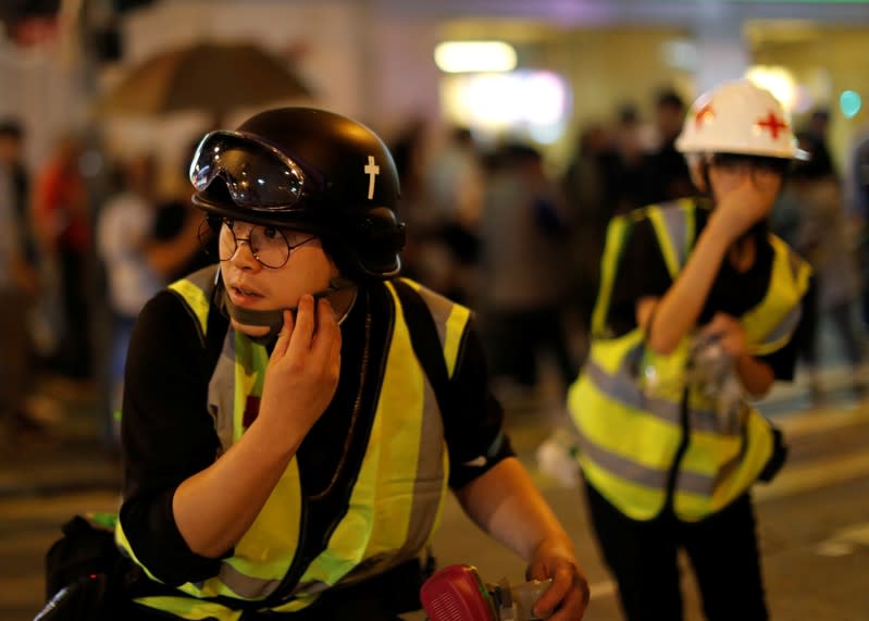 The Wider Image: Sermons with saline: Hong Kong pastor offers aid and prayers