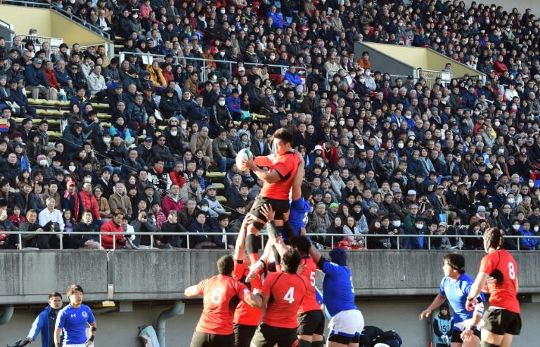 Fans watch the University Rugby Football Championship final match between Teikyo University and Tokai University, in Tokyo, on January 10, 2016
