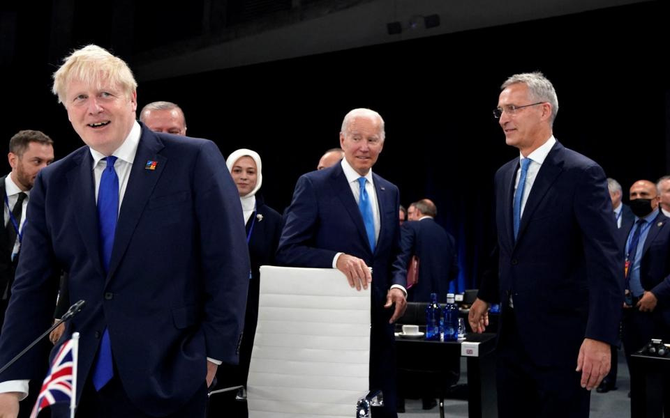 Boris Johnson, US President Joe Biden and NATO Secretary General Jens Stoltenberg attend a round table meeting at the NATO summit in Madrid, Spain, today - Reuters