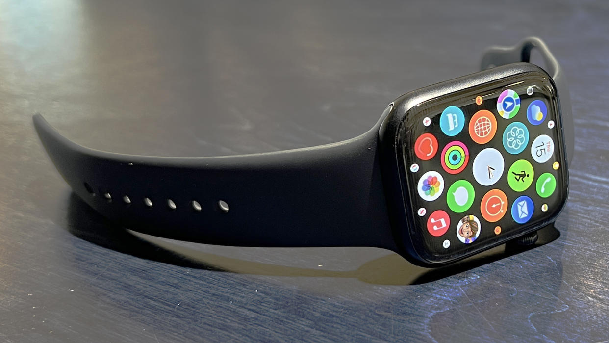  The Apple Watch 8 lying on its side with the home screen on show 