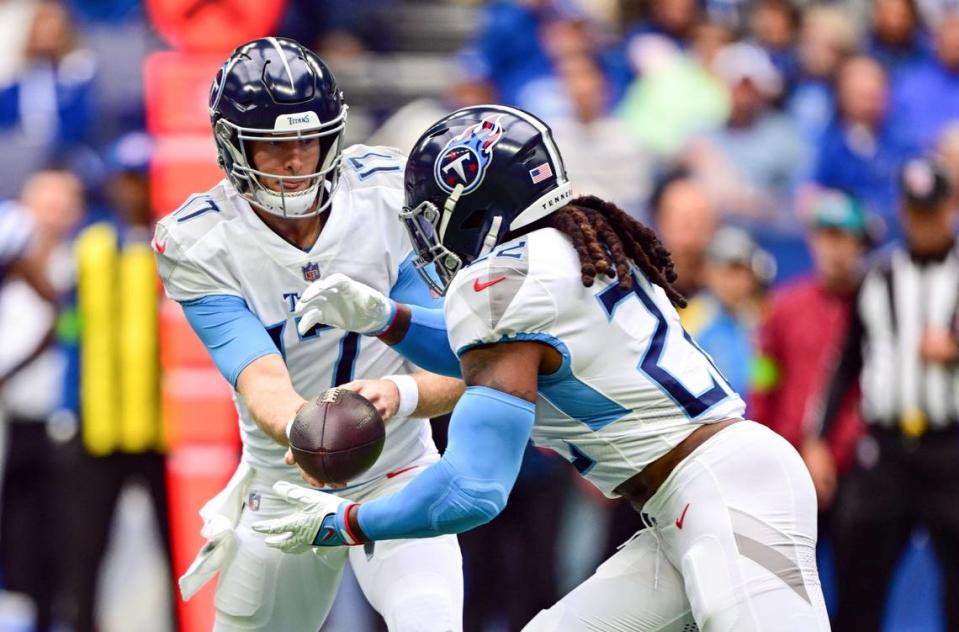 Oct 8, 2023; Indianapolis, Indiana, USA; Tennessee Titans quarterback Ryan Tannehill (17) hands the ball off to Tennessee Titans running back Derrick Henry (22) during the first quarter against the Indianapolis Colts at Lucas Oil Stadium. Mandatory Credit: Marc Lebryk-USA TODAY Sports